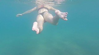 Aquatica's feet melted in the blue sea