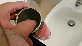 Boy pisses in the tube of pringles