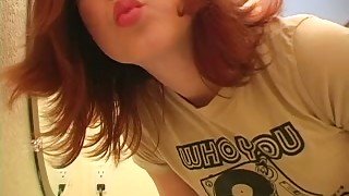 Check out this redhead teen cutie putting on makeup