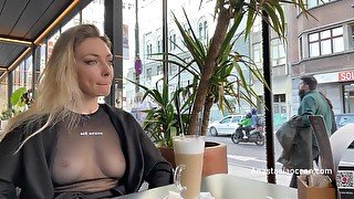 Flashing tits in cafe with glass walls so all people outside see me. Transparent t-shirt no bra.