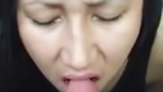 Horny Asian teen sucks big cock