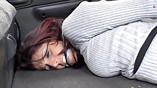 Hot redhead hogtied and gagged in the trunk