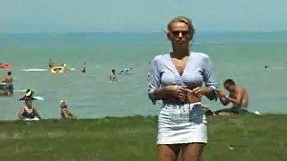 Crazy pee girl on the beach