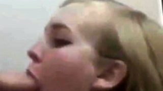 Blonde college girl gives a blowjob on her knees