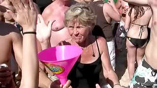 Doting amateur shows off her nice ass close up at a saucy beach party