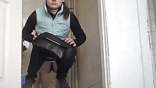 White chick in the toilet gets filmed on cam when she pisses