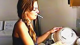 Cute chick smokes around the house