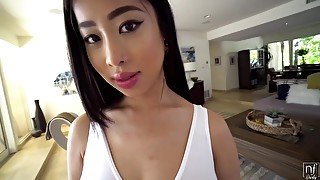 Slim Asian brunette is using her deep, moist throat to suck dick before she starts riding it