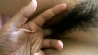 Pretty Oriental babe gets her hairy slit fingered and fucked