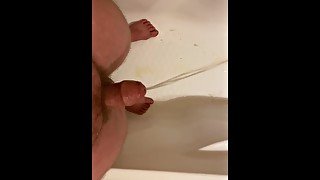 Guy desperately leaking pee and pre cum before a massive piss explosion