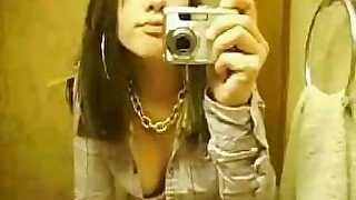 Hot and slutty brunette teen films herself in the bathroom