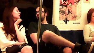 Hot redheaded chick gets seduced by a nerdy dude on the tra