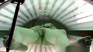 Punk Girl Secretly Masturbating in Solarium Tube