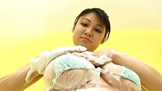 Busty oriental chick Hikari Asahi eating banana