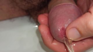 close up pissing and playing with peehole