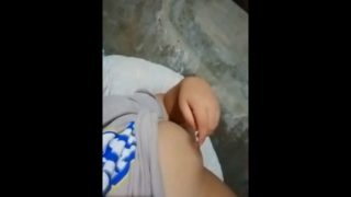 Filipina playing with her tities