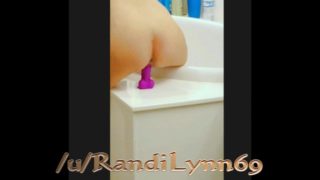 Dildo and plug in the bathroom