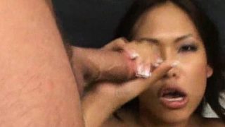 Naughty Asian chick uses her lips and hands to please two big pricks