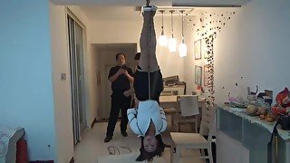 Asian tied upside down