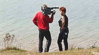 Redhead mature interviewed in the open