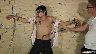 Older dude with glasses kisses and sucks a dick of a tied up dude