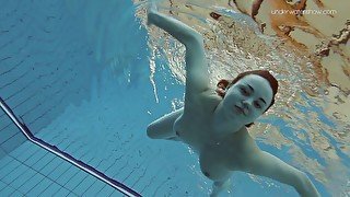 Salacious babe Lada Poleshuk shows her tits and pussy under the water