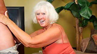 Cute blonde granny Jeannie knows how to suck a brown cock