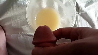 Slow Motion cum into cup full of cum