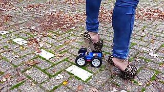 High heels crush toy car