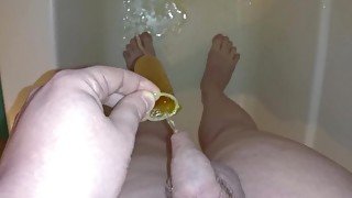 Pee into condom and masturbate + cum in it