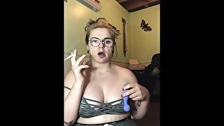 Milf smokes and plays with sex toy