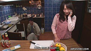 Kinky Asian housewife Nozomi Hazuki gives a blowjob to one kinky plumber