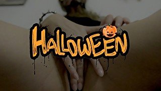 Naughty petite blonde in Halloween costume shows her pussy and pleases herself with fingers