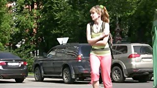 Slim girl pees in her legging while walking in the street