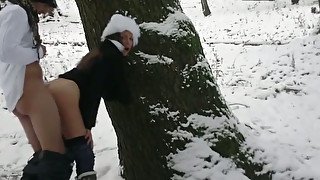 Ardent rear banging scene in the cold winter forest