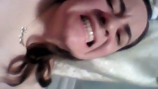 Giggling chick with natural tits flashes her such a nice bald pussy