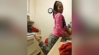 Housewife With A Ponytail Teases With Her Sexy Feet While Making A Din