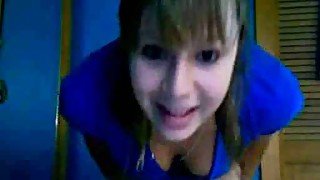 Cute blonde teenie in her panties and T-shirt playing on webcam