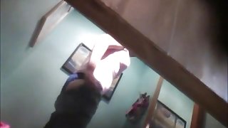 Girl puts on pants and loses of bra on the voyeur camera