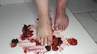 Latina wife Steps on black berries while husband watches.