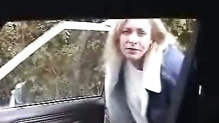 Mature blonde housewife gives a quick blowjob in the car