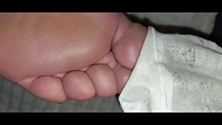 Removing her moist ankle socks and licking the dirt off her mature feet