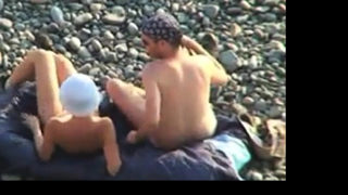 Voyeur on public beach. Oral sex