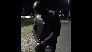 doubled cocked masked wetsuited guy jerking off outside