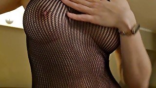 A fit girl showing around a presidential suite in her sexy fishnet bodysuit