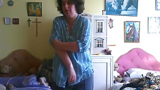 Nerdy chubby girl strips, rides a pillow and fingers her pussy standup.