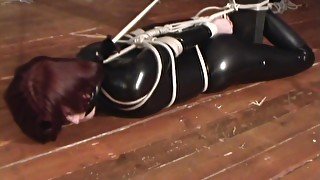 Ball Gagged and Floor Tied in pvc Catsuit