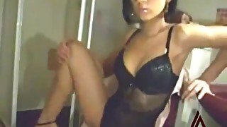 Beauty in black lingerie rubs pussy on camera