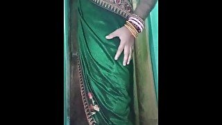 Indian gay Crossdresser Gaurisissy in Green Saree pressing her big Boobs and fingering in her ass