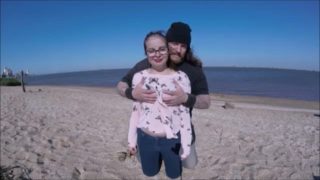 CUTE TEEN ON BEACH WITH WIND